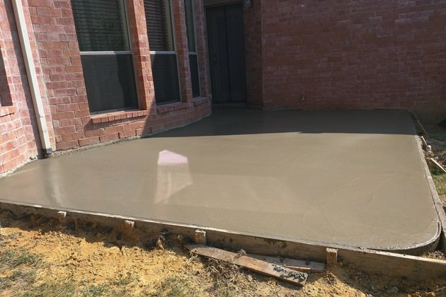 Empire Concreters team pouring a concrete slab on a construction site