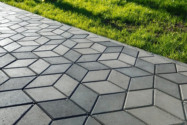 Outdoor area with stamped concrete flooring in a modern geometric pattern